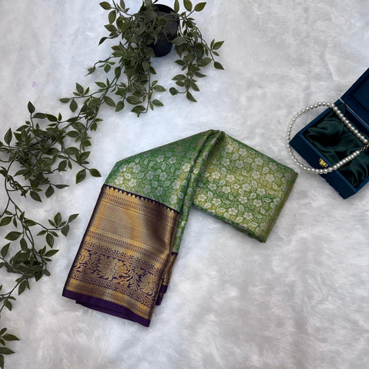 Kanchi Soft Silk Saree in Leaf Green with Antique Gold Zari and Purple Border