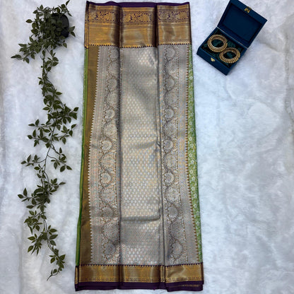 Kanchi Soft Silk Saree in Leaf Green with Antique Gold Zari and Purple Border
