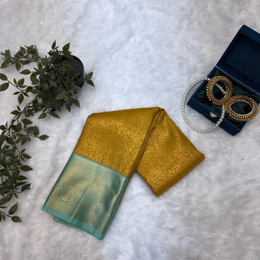 Kanchi Soft Silk Saree in Mustard Yellow with Antique Gold Zari and Mint Green Borders